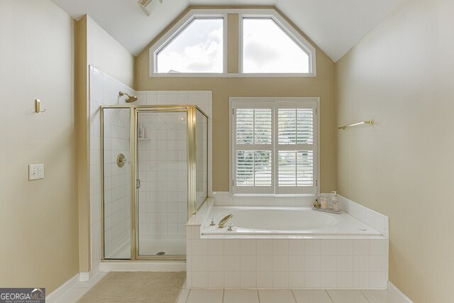bathroom with a healthy amount of sunlight, tile patterned floors, a bath, visible vents, and a shower stall