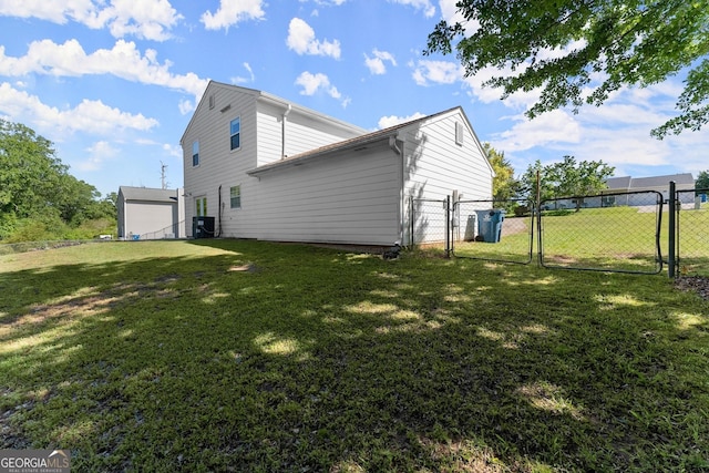 view of side of home featuring a yard, a gate, and fence