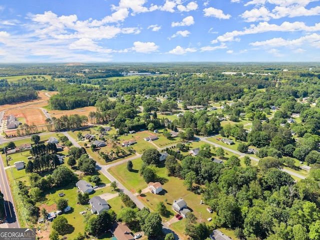 drone / aerial view with a view of trees
