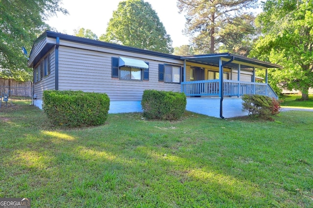 single story home with fence and a front yard