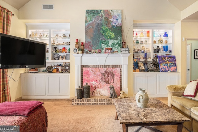 137 New Cut Rd, Winder, GA 30680 - living area with lofted ceiling, carpet flooring, and a fireplace