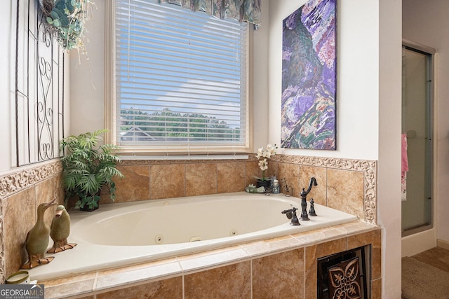 137 New Cut Rd, Winder, GA 30680 - full bathroom with healthy amount of natural light, a stall shower, and a jetted tub