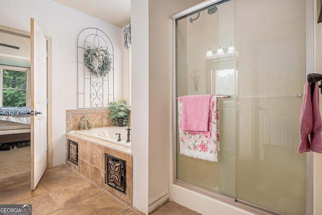 137 New Cut Rd, Winder, GA 30680 - bathroom featuring a shower stall, connected bathroom, a garden tub, and tile patterned floors