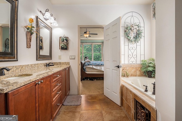 137 New Cut Rd, Winder, GA 30680 - ensuite bathroom with ceiling fan, double vanity, and a bathtub