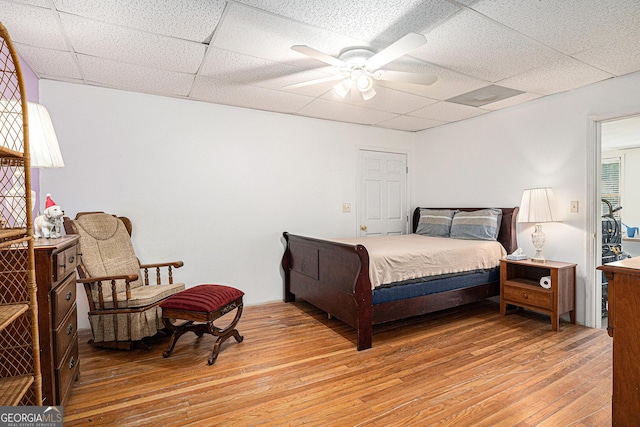 137 New Cut Rd, Winder, GA 30680 - bedroom featuring a paneled ceiling, light wood-style floors, and a ceiling fan