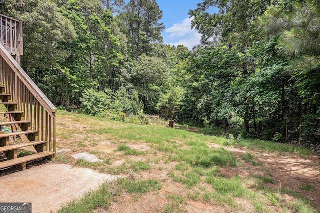 137 New Cut Rd, Winder, GA 30680 - view of yard with stairway and a wooded view