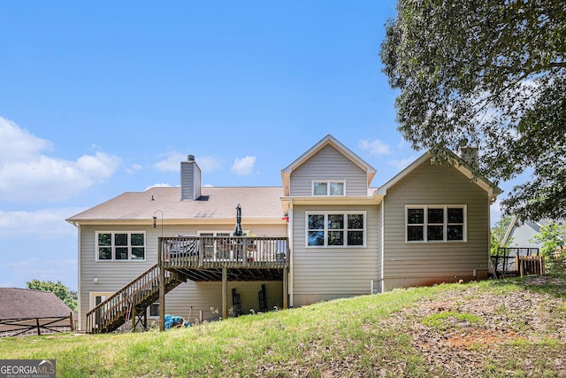 137 New Cut Rd, Winder, GA 30680 - back of property with a deck, stairs, and a chimney
