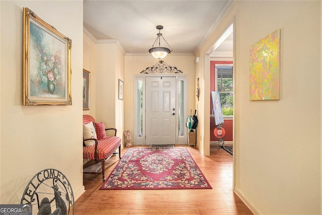 137 New Cut Rd, Winder, GA 30680 - entryway with light wood-style flooring, crown molding, and baseboards