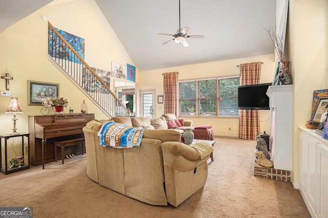 137 New Cut Rd, Winder, GA 30680 - carpeted living room with high vaulted ceiling, a ceiling fan, and stairway