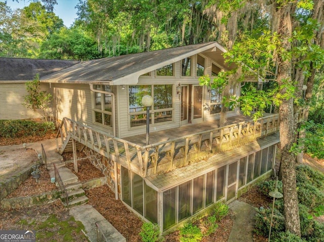 view of outbuilding with a sunroom
