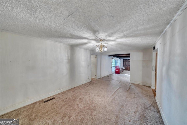carpeted empty room featuring a textured ceiling, visible vents, and baseboards