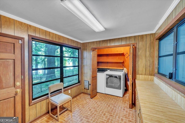 interior space featuring wooden walls, brick patterned floor, independent washer and dryer, and crown molding