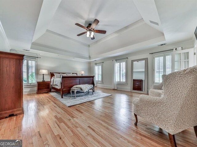 139 Grandmar Chase, Canton, GA 30115 - bedroom with a tray ceiling, multiple windows, light wood-type flooring, and visible vents