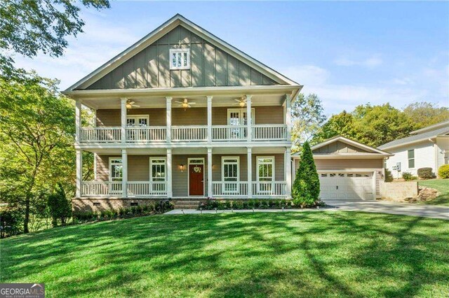435 Webb Dr, Norcross, GA 30071 - view of front of house featuring an attached garage, concrete driveway, board and batten siding, a front yard, and a porch