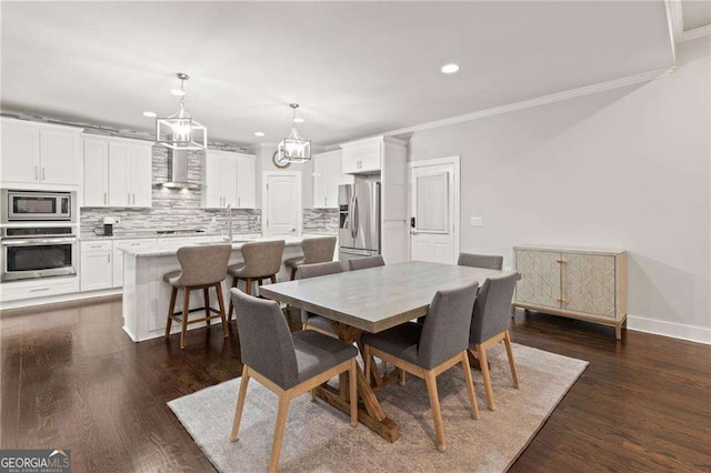 435 Webb Dr, Norcross, GA 30071 - dining area with an inviting chandelier, crown molding, baseboards, and recessed lighting