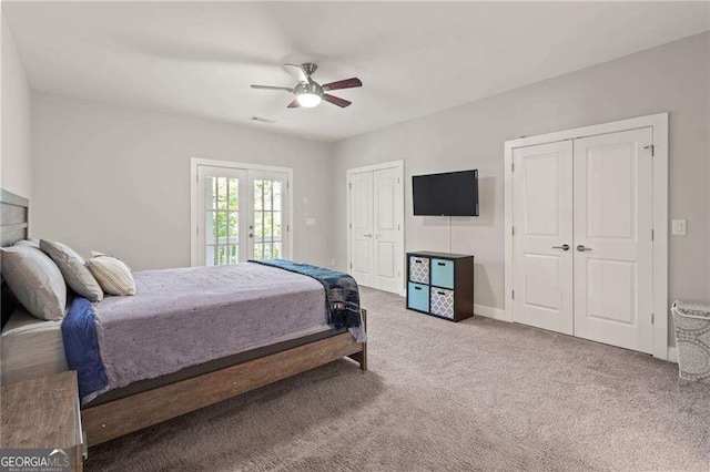 435 Webb Dr, Norcross, GA 30071 - bedroom featuring french doors, two closets, ceiling fan, carpet flooring, and access to exterior