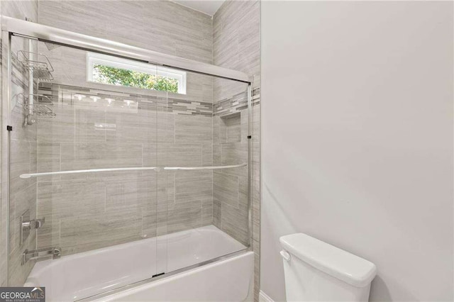 435 Webb Dr, Norcross, GA 30071 - bathroom featuring toilet and shower / bath combination with glass door