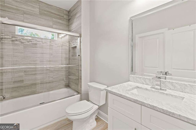 435 Webb Dr, Norcross, GA 30071 - full bath with toilet, vanity, and shower / bath combination with glass door