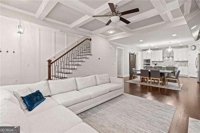 435 Webb Dr, Norcross, GA 30071 - living area with wood finished floors, a ceiling fan, coffered ceiling, stairway, and beamed ceiling