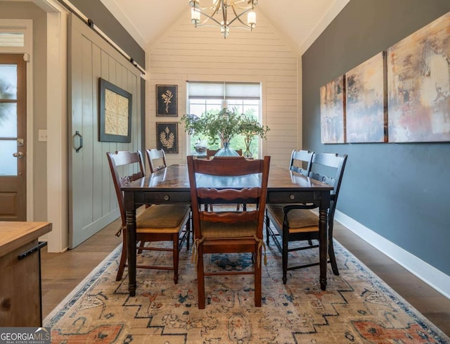 13 Jamilee Cv, Cartersville, GA 30120 - dining area with baseboards, a notable chandelier, wood finished floors, and vaulted ceiling