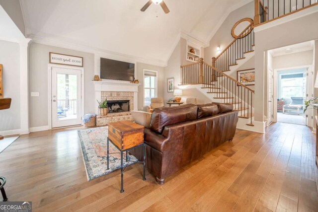13 Jamilee Cv, Cartersville, GA 30120 - living room with stairway, ceiling fan, light wood finished floors, and a fireplace with raised hearth