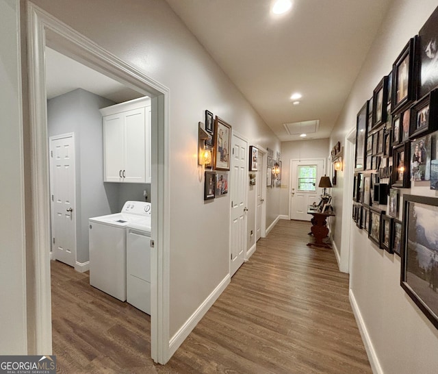 corridor featuring washing machine and dryer, wood finished floors, baseboards, and recessed lighting