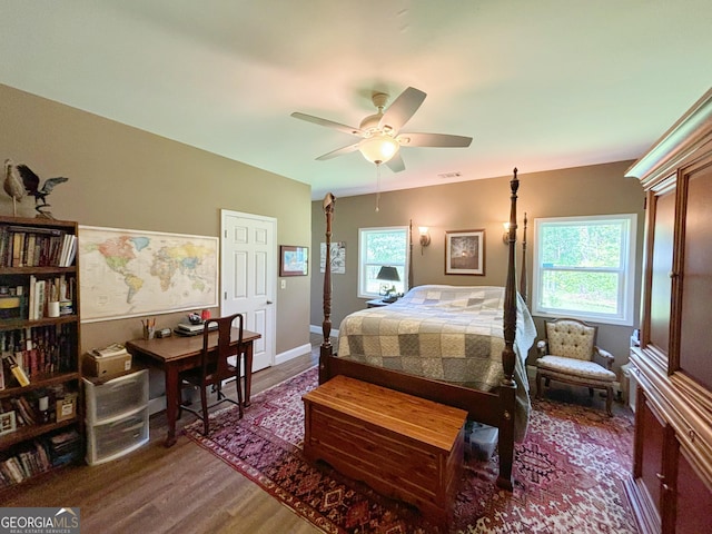 bedroom featuring wood finished floors and a ceiling fan