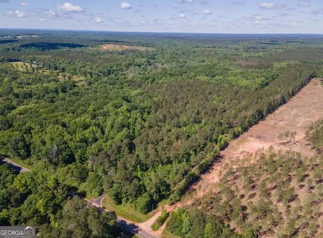 aerial view with a wooded view