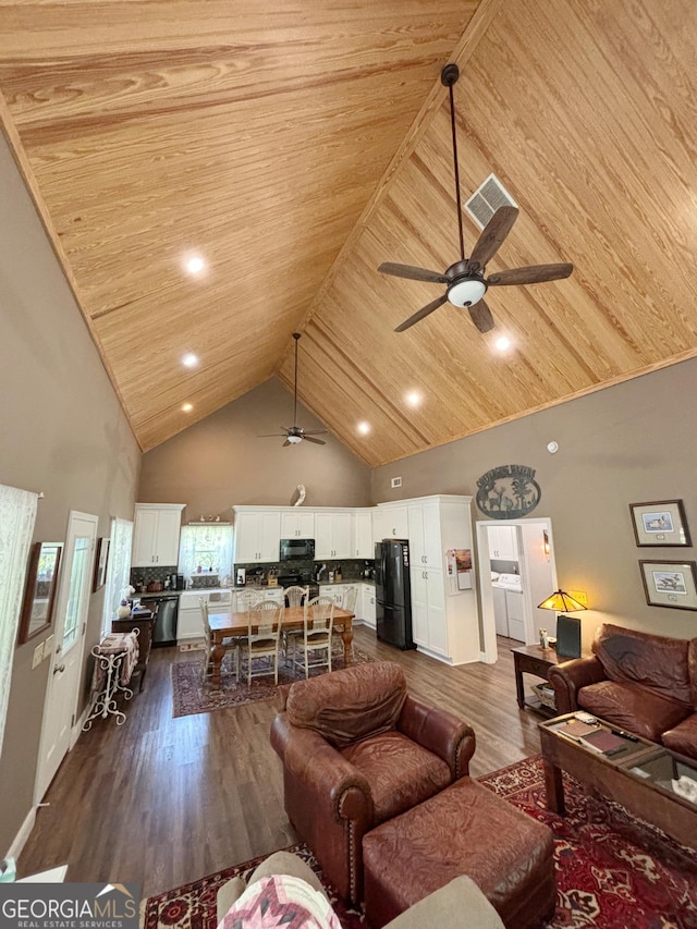 living room featuring wood ceiling, a ceiling fan, dark wood-style floors, and high vaulted ceiling