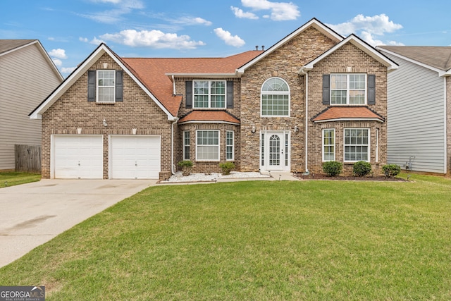 6637 Chason Woods Ct, Jonesboro, GA 30238 - traditional-style house featuring concrete driveway, a front lawn, an attached garage, roof with shingles, and brick siding