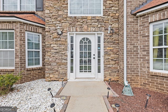 6637 Chason Woods Ct, Jonesboro, GA 30238 - view of exterior entry featuring stone siding and brick siding