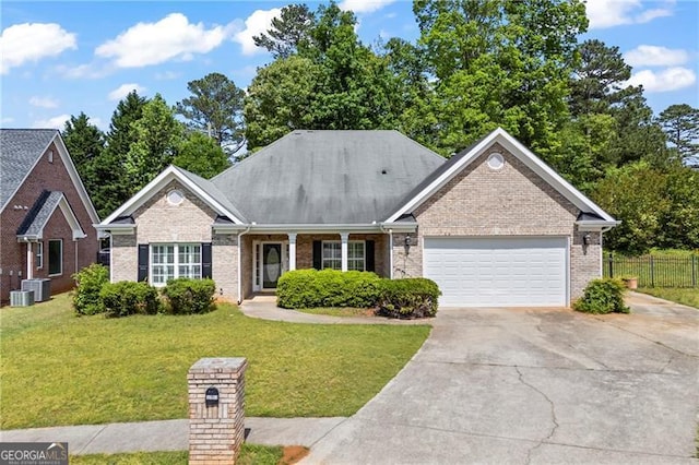 4368 Magnolia Bay Ln, Snellville, GA 30039 - single story home with driveway, brick siding, fence, an attached garage, and a front yard
