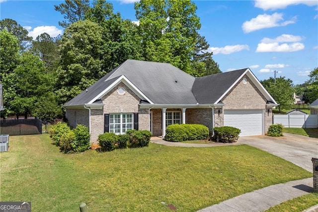 4368 Magnolia Bay Ln, Snellville, GA 30039 - ranch-style house featuring driveway, brick siding, fence, a garage, and a front yard