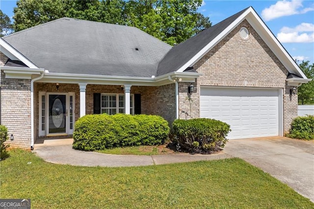 4368 Magnolia Bay Ln, Snellville, GA 30039 - ranch-style house featuring an attached garage, brick siding, driveway, and a front lawn