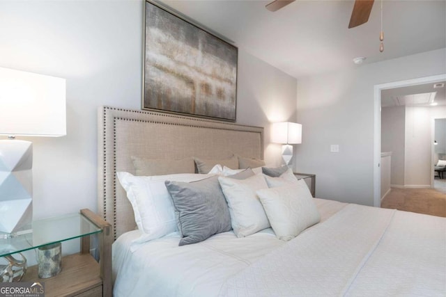bedroom featuring attic access, ceiling fan, and carpet floors