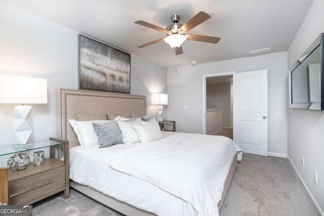 bedroom with ceiling fan, carpet floors, and baseboards