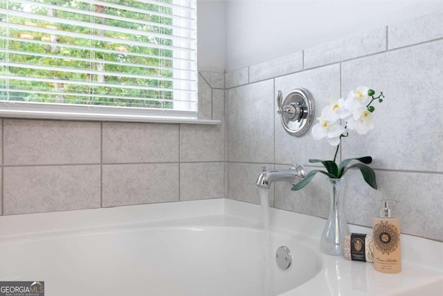 bathroom featuring a tub to relax in