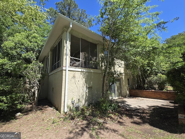 863 Boulevard, Macon, GA 31211 - view of property exterior with a sunroom and brick siding