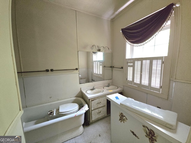 863 Boulevard, Macon, GA 31211 - bathroom with toilet, vanity, ornamental molding, a tub, and tile patterned flooring