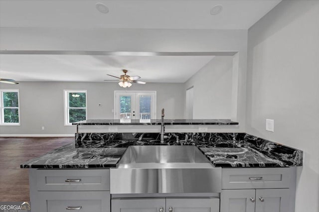 212 Lake Forest Dr, Acworth, GA 30102 - kitchen featuring ceiling fan, open floor plan, dark wood-style flooring, and healthy amount of natural light