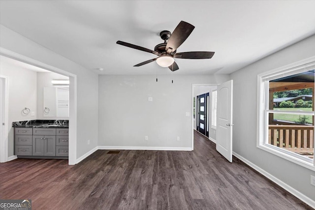 212 Lake Forest Dr, Acworth, GA 30102 - unfurnished living room featuring ceiling fan and dark wood finished floors
