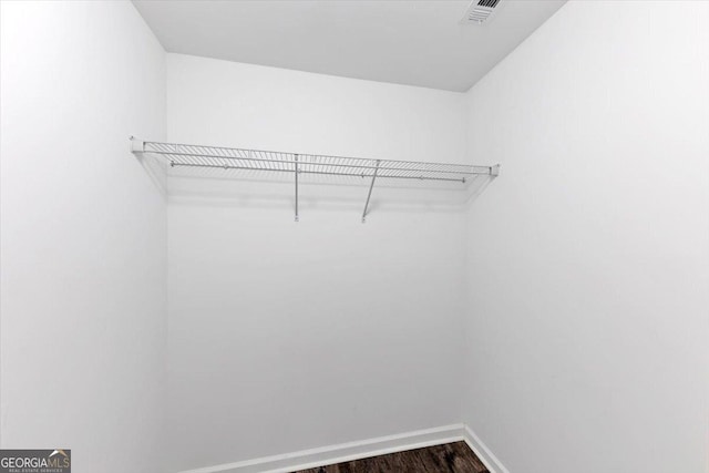 212 Lake Forest Dr, Acworth, GA 30102 - walk in closet featuring dark wood-type flooring