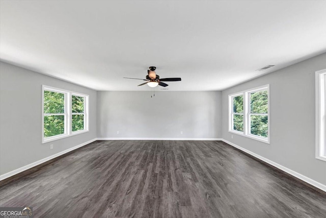 212 Lake Forest Dr, Acworth, GA 30102 - empty room featuring healthy amount of natural light, dark wood-style floors, and a ceiling fan