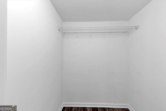 212 Lake Forest Dr, Acworth, GA 30102 - spacious closet featuring dark wood finished floors