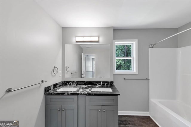 212 Lake Forest Dr, Acworth, GA 30102 - bathroom with bathtub / shower combination, double vanity, and wood finished floors