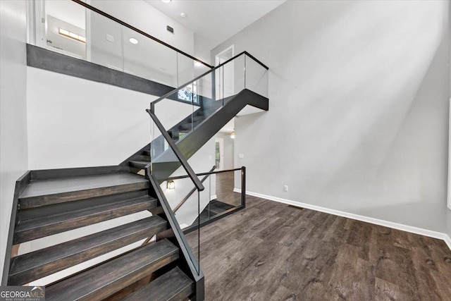212 Lake Forest Dr, Acworth, GA 30102 - stairway featuring wood finished floors and a high ceiling