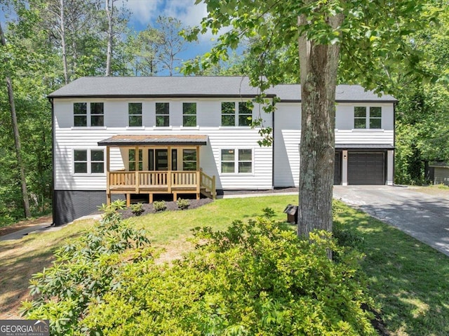 212 Lake Forest Dr, Acworth, GA 30102 - view of front facade with an attached garage, driveway, and a front yard