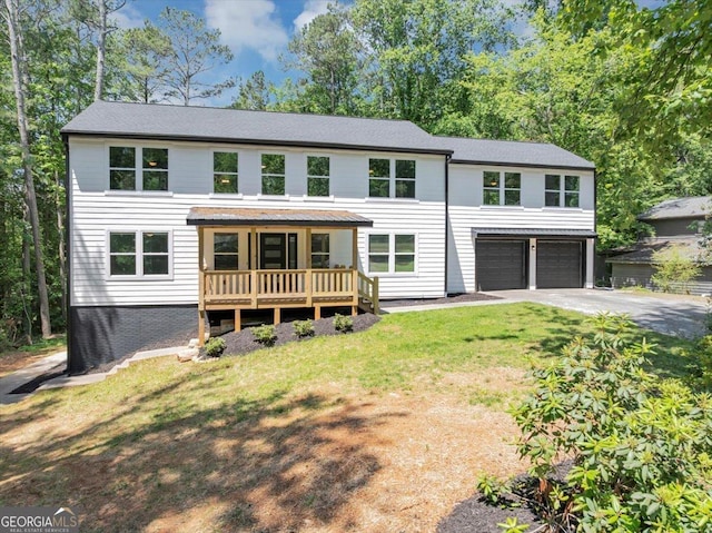 212 Lake Forest Dr, Acworth, GA 30102 - view of front facade featuring an attached garage, concrete driveway, and a front yard