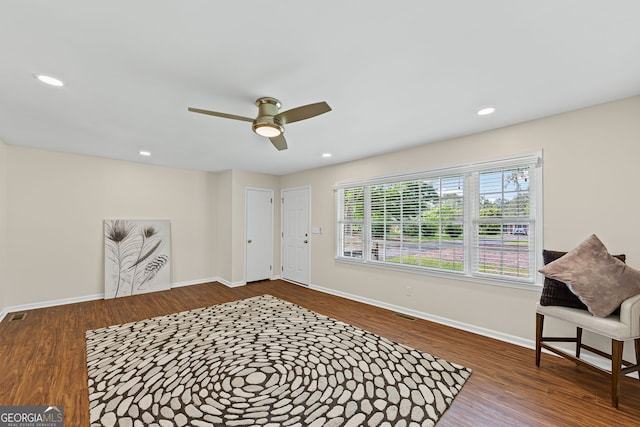 interior space featuring recessed lighting, baseboards, a ceiling fan, and wood finished floors