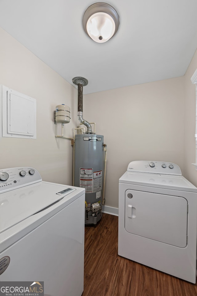 washroom with electric panel, water heater, laundry area, dark wood finished floors, and washing machine and clothes dryer